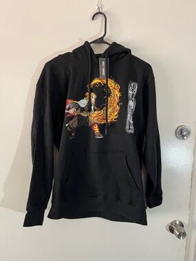 Black Graphic Pullover Hoodie with Fiery Anime Design